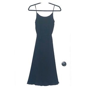 black pleated knee length dress